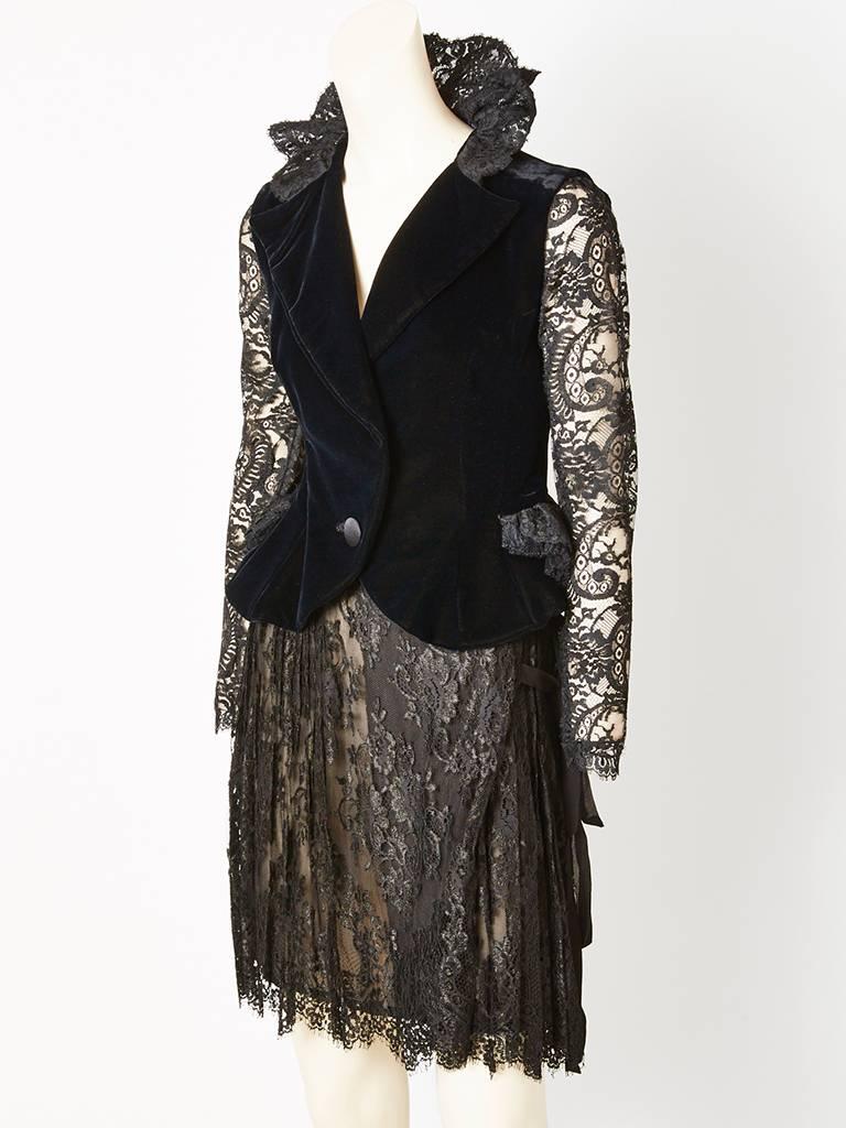 Christian LaCroix, lace and velvet, jacket and skirt, cocktail, ensemble. Jacket is fitted with a slight, peplum, having sheer lace sleeves, a single button closure, with a stand up lace, 