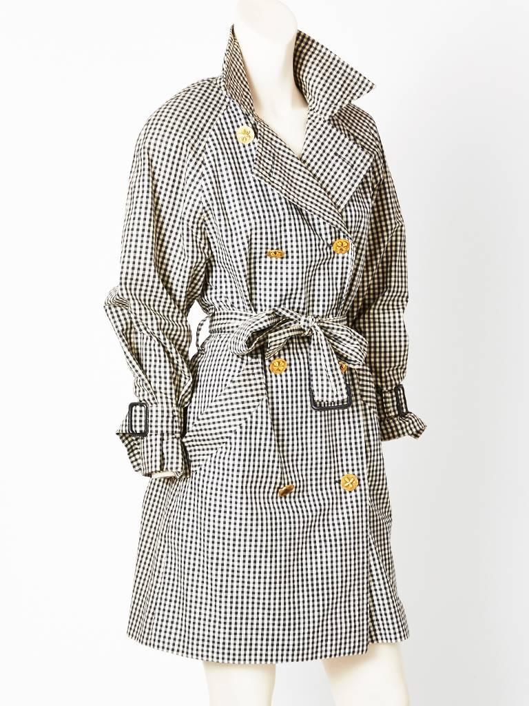 Chanel, black and white gingham check, double breasted, classic, belted trench, having raised 