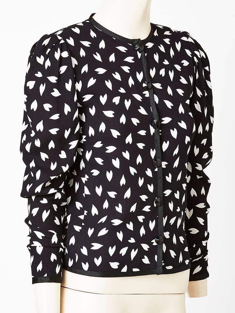 Yves Saint Laurent, semi fitted, silk crepe patterned jacket having a black ground with a small abstract white 