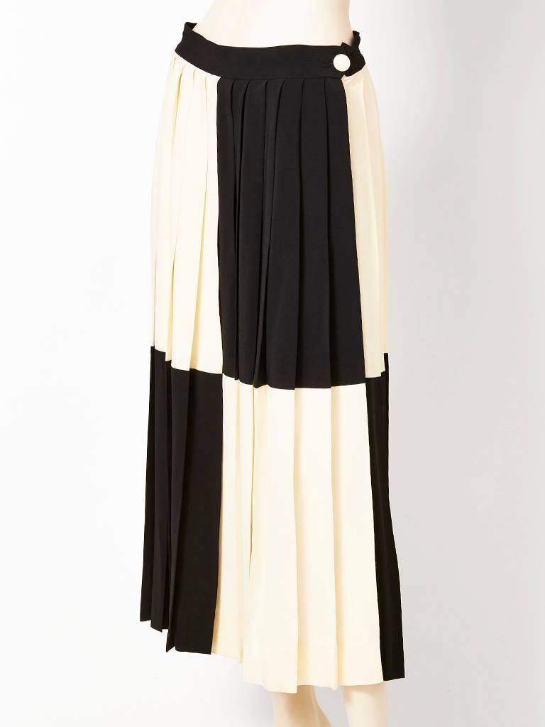 Moschino, graphic, black and white color block, 3 ply crepe pleated skirt.
