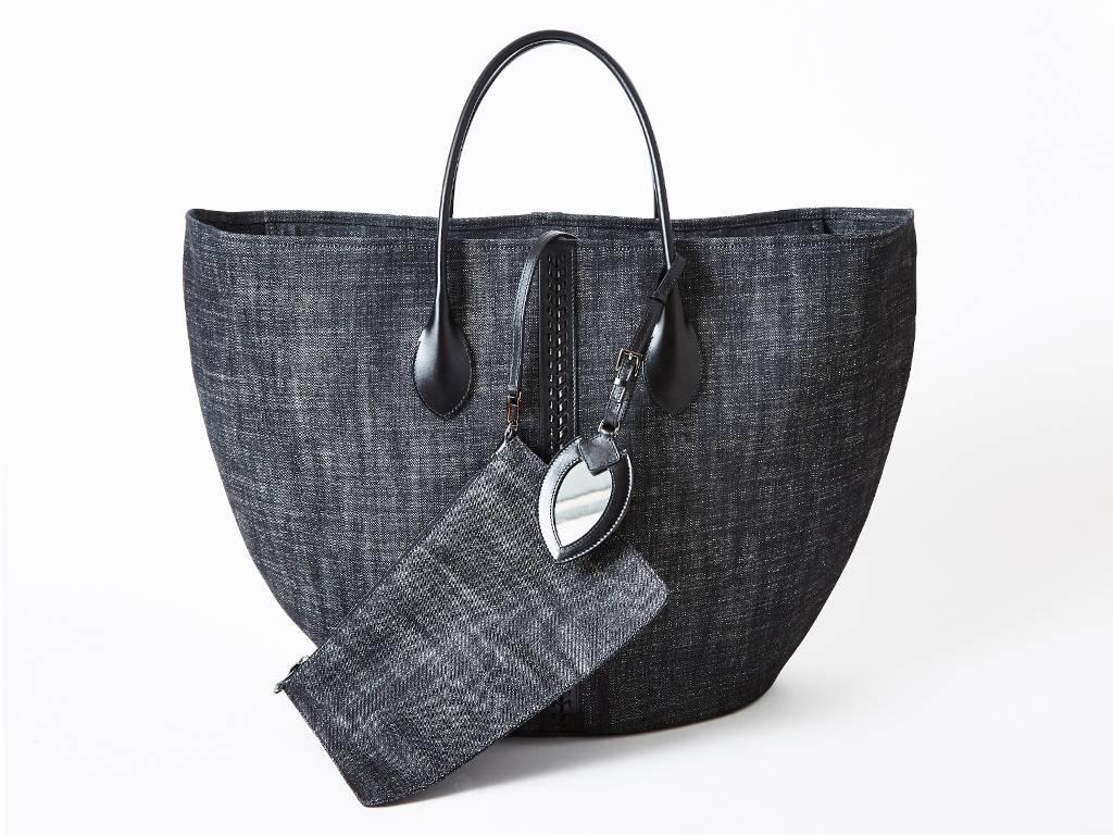 Alaia, black denim zippered, large Cabas tote having leather handles and a braided leather center front and back detail. New with tags.