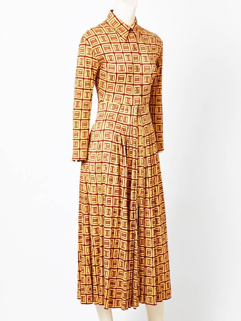Galanos, silk jersey knit, shirt waist maxi dress with stitched down pleating coming from the waist to the hip. Loose pleats are at the hip to hem. Collar has top stitching detail and at the center front going down. Hidden slit in the center front.