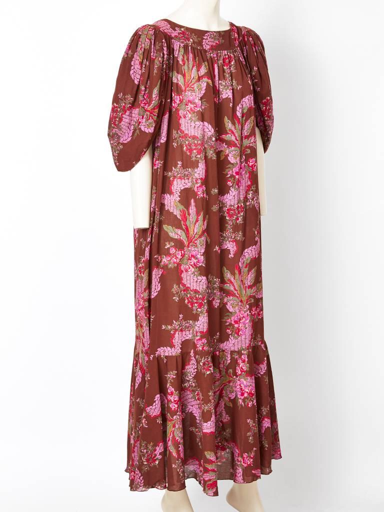 Karl Lagerfeld, for Chloe, floral pattern, smock, maxi dress having a gathered tier starting at the knee and going to the ankle. Sleeve treatment is blouson at the shoulder having a slanted cut at the elbow. Dress is made of a cotton voile having