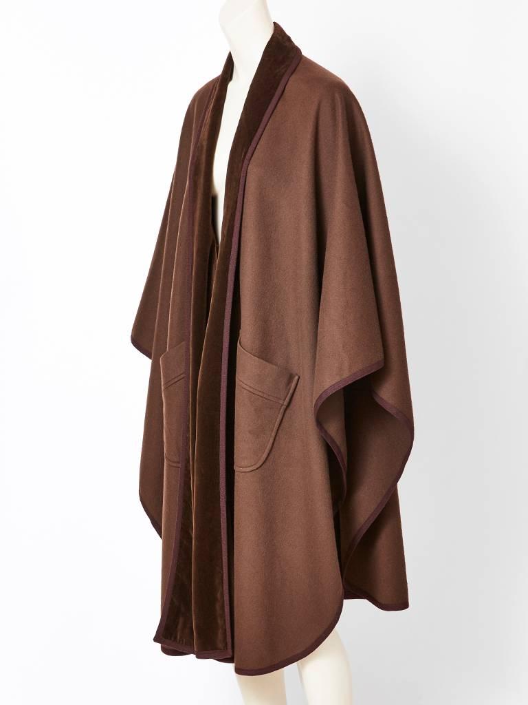 Yves Saint Laurent, rich brown, wool cape, ( open poncho style) with velvet trim and deep patch pockets. 
