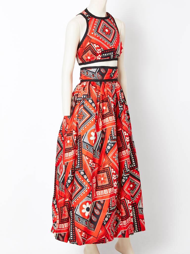 Geoffrey Beene, silk twill bandana print top and skirt ensemble. Midriff top has a halter cut  sleeve and a razor like back. Skirt is gathered with a high waist and lined in an organza to give the skirt body.
