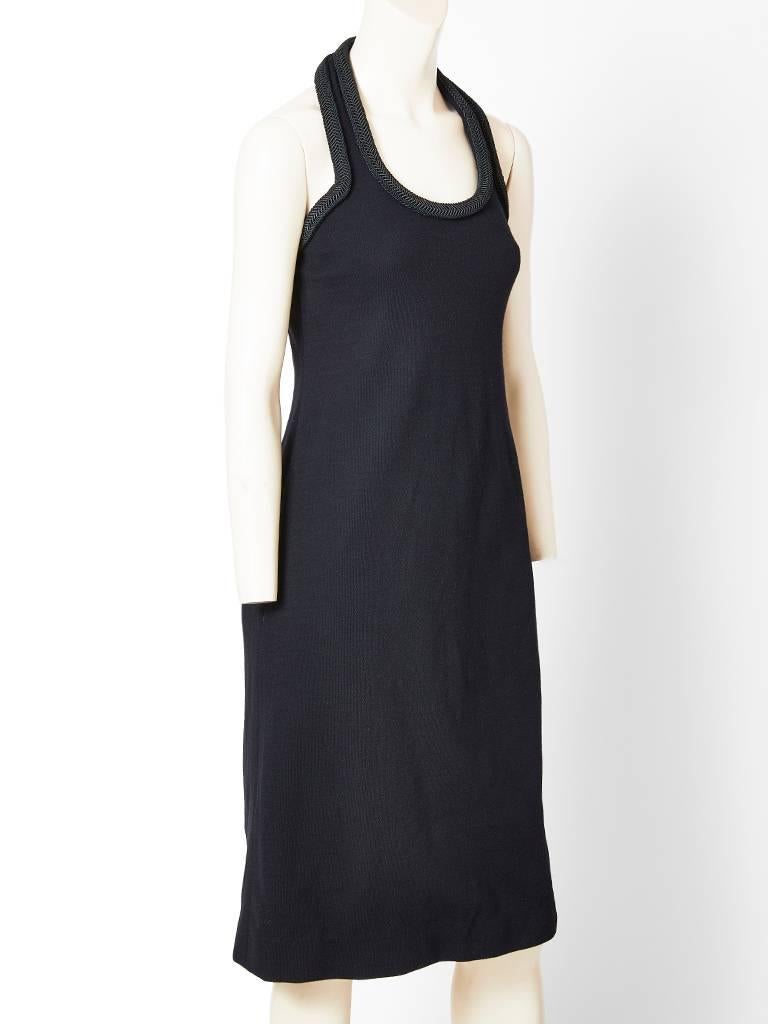 Galanos, black, wool crepe, halter neck cocktail dress having thick braiding detail along the neckline. Back is open. Simple sightly A line silhouette.