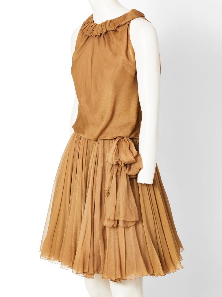 Galanos, taupe tone, multilayered silk georgette, cocktail dress, having a halter cut sleeve, a soft ruffled neckline, and a bodice that is slightly blouson. Skirt is gathered with multiple layers of bias cut chiffon...This dress was specially made