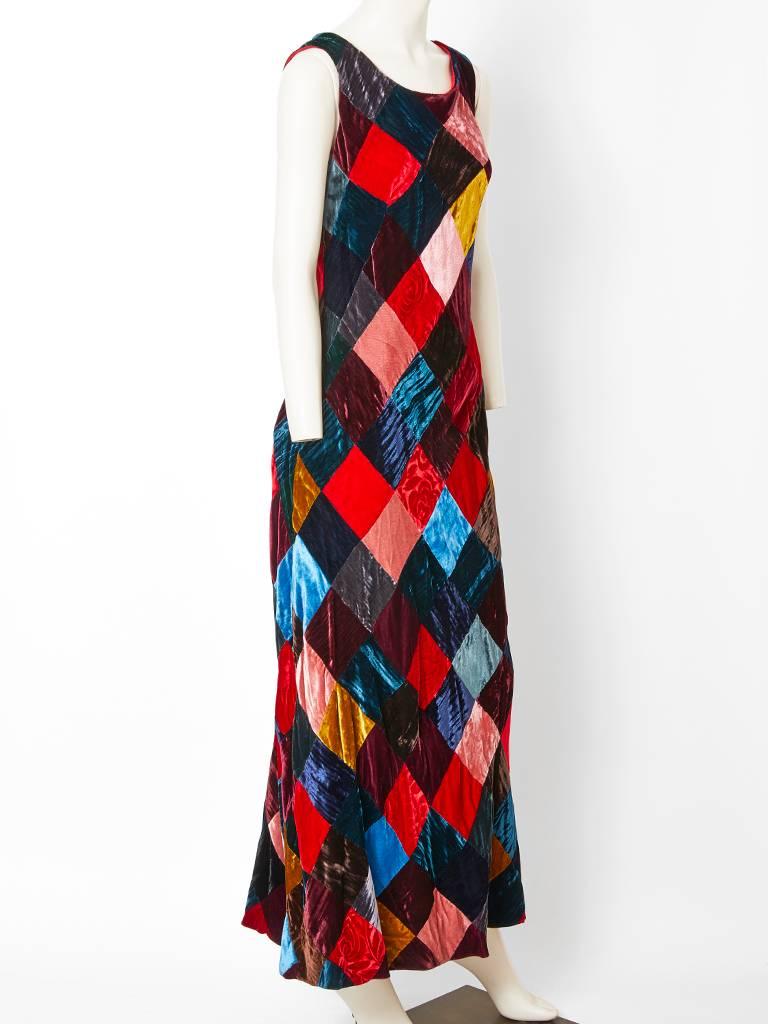 Dolce and Gabanna, jeweled tone, velvet, patchwork, bias cut sleeveless gown with a scoop neckline.