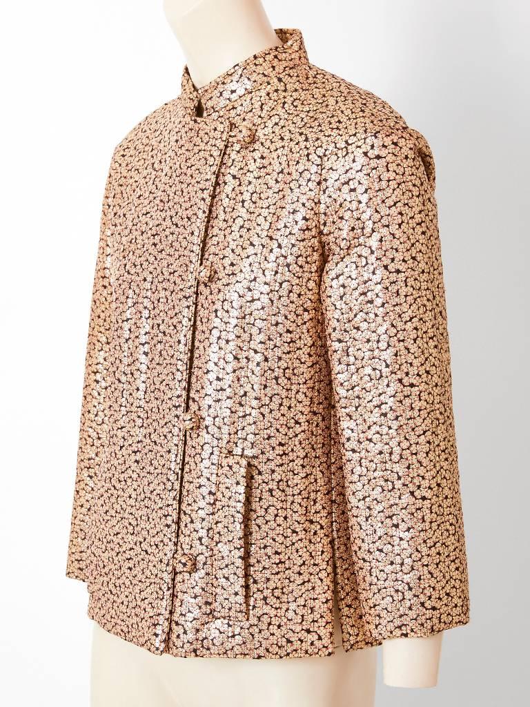 Givenchy Nouvelle Boutique, patterned gold lamé, vertical quilted evening jacket, having a Mandarin collar, off center closure and vertical pocket slits on the front sides.