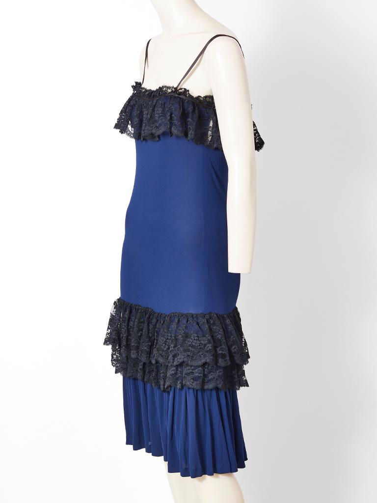 Yves Saint Laurent, Rive Gauche, slip dress, having a french blue, body in a jersey crepe. The thin,  silk shoulder straps are black. There is a black lace, gathered, flounced tier by the bust and two black lace gathered tiers at the lower thigh. A