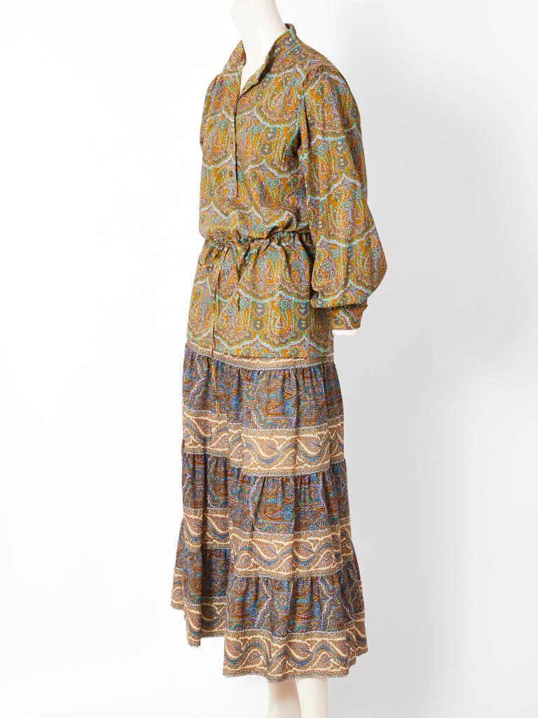 Yves Saint Laurent, wool Challis, paisley pattern skirt and top in shades of greens, and blues.
Top has a mandarin collar,with a button front and drawstring waist, which can be worn as tunic.
Gathered skirt has an elastic waist,  with several tiers