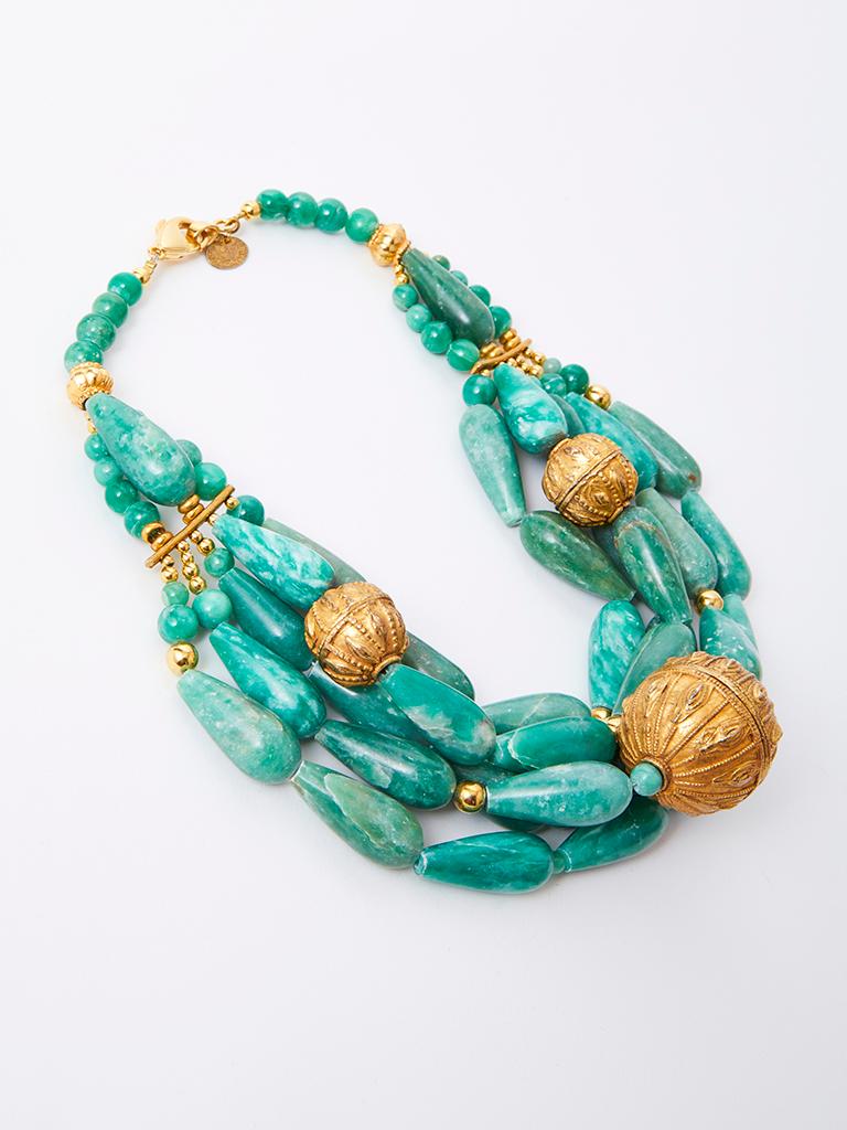 Yves Saint Laurent RIve Gauche, 5 strand jadeite, necklace, embellished with round gold tone embossed, Asian inspired  beads of various sizes.