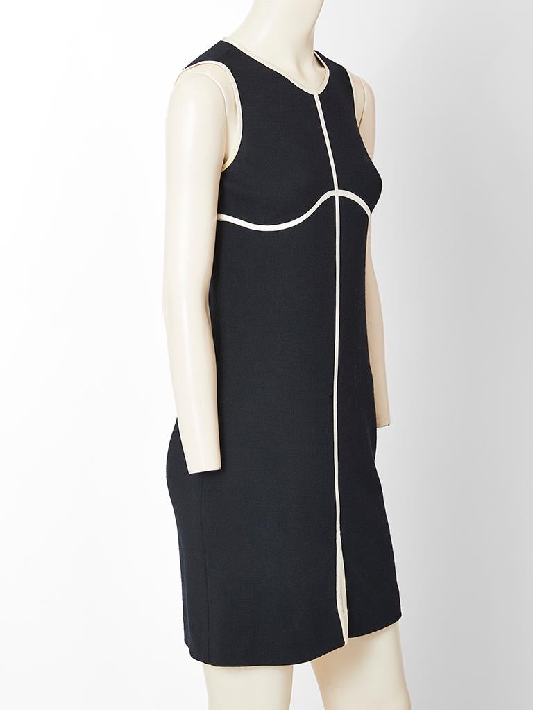 Geoffrey Beene, sleeveless wool jersey shift dress having white satin piping detail.