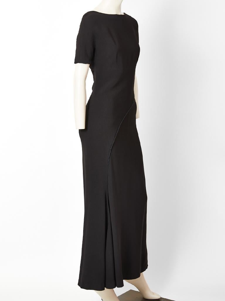  Balenciaga, Le Dix, short sleeve,  silk crepe,  bias cut, maxi dress with a curved piping detail. Simple elegant lines.
Designer : 

