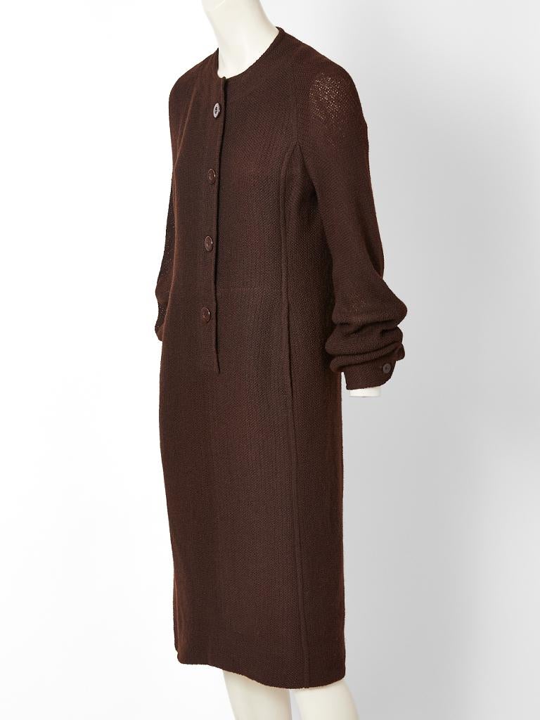 Pierre Balmain Couture,  chocolate brown, textured wool, long sleeve, simple lines, day dress, having a semi fitted silhouette, no collar, balloon sleeves and front button closures. 