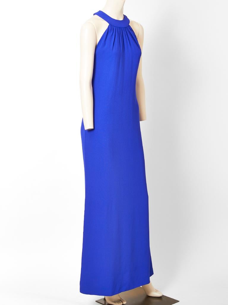 Yves Saint Laurent, Rive Gauche, cobalt blue, semi fitted gown, having halter cut sleeves, with a gathered collar neckline. Dress is made of a viscose satin back crepe.