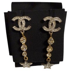 CHANEL Silver Gold Crystal CC Star Dangle Earrings