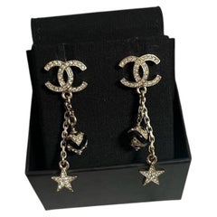 CHANEL Silver Crystal CC Star Charm Dangle Earrings