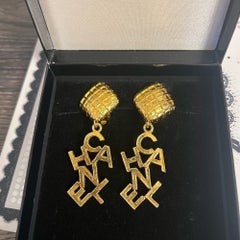 CHANEL Vintage Gold Dangle "CHANEL" Clip On Earrings