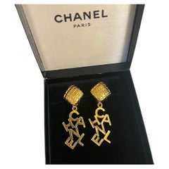 CHANEL Vintage Gold Dangle "CHANEL" Clip On Earrings