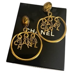 Chanel Vintage Gold "CHANEL" Letters Dangle Clip On Earrings
