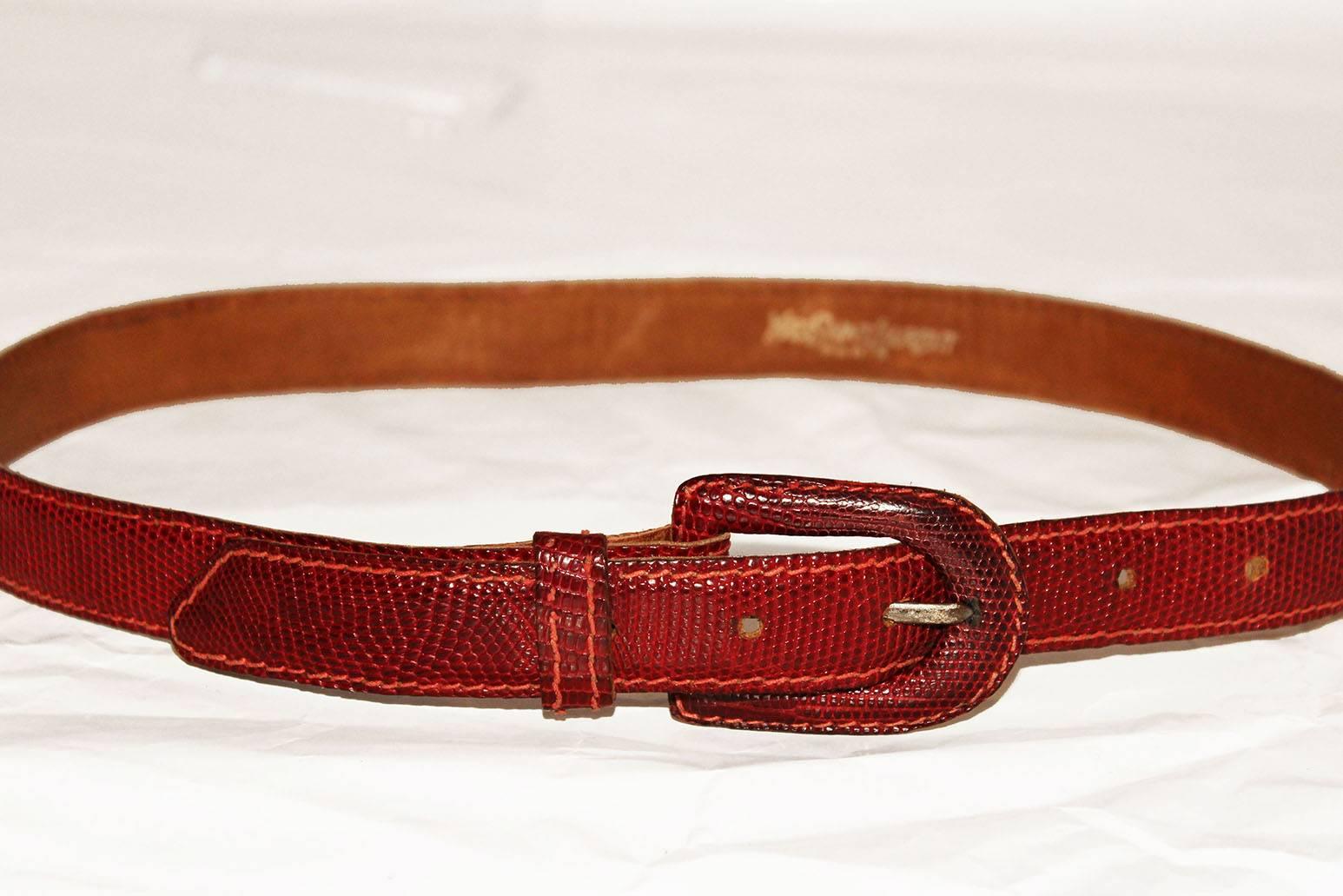This Yves Saint Laurent, Paris belt will be a bright addition to any wardrobe.In a lovely deep red colour,the belt has an elegant oval buckle , one belt loop,and six notches.