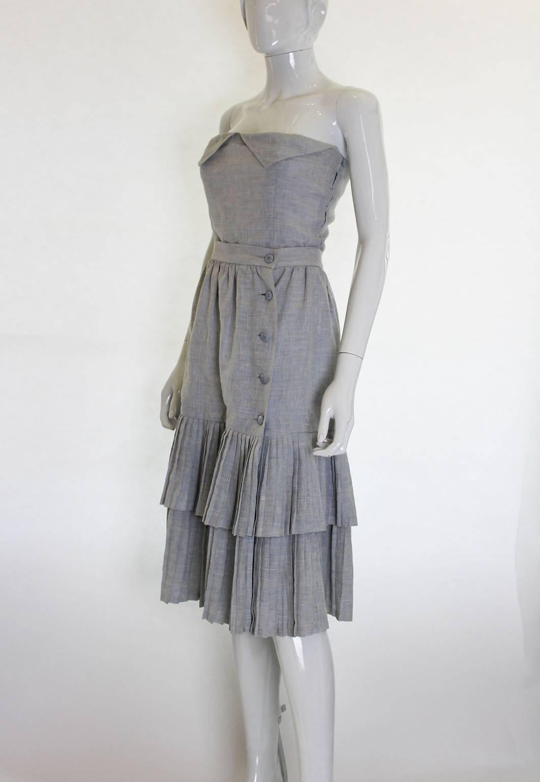 A super outfit for Summer, this Lanvin, Paris, skirt and bustier look wonderful together, but alternatively was be worn separately with other items.
The fabric is a silk and linen mix, in a charming blue and and white stripe.
The bustier is boned,