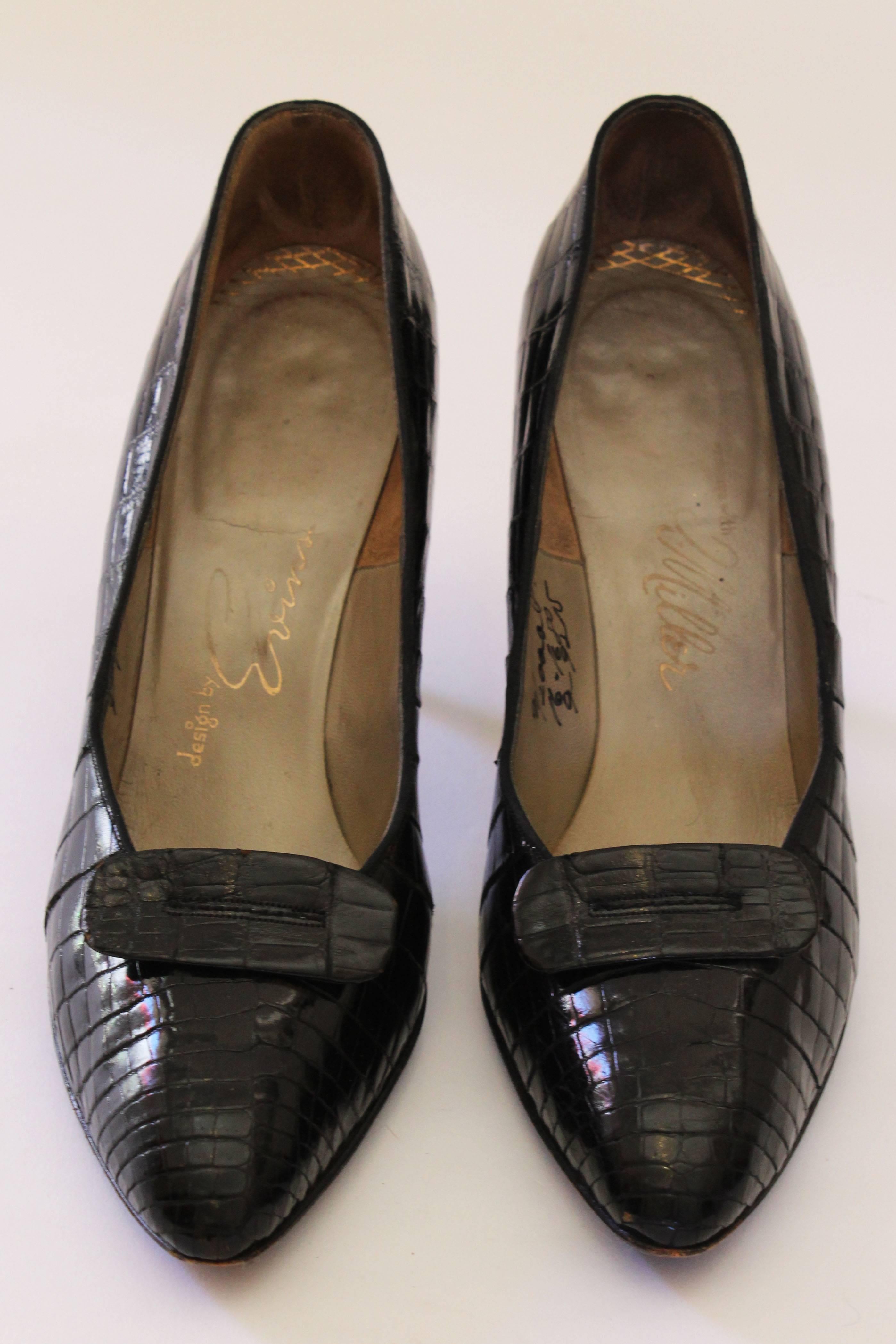 A chic pair of black crocodile court shoes with an oval tab on the front.
These shoes are beautifully made, and have leather lining and soles. The heel height is 3 1/2''.and they are about a UK 6 1/2, EU 39