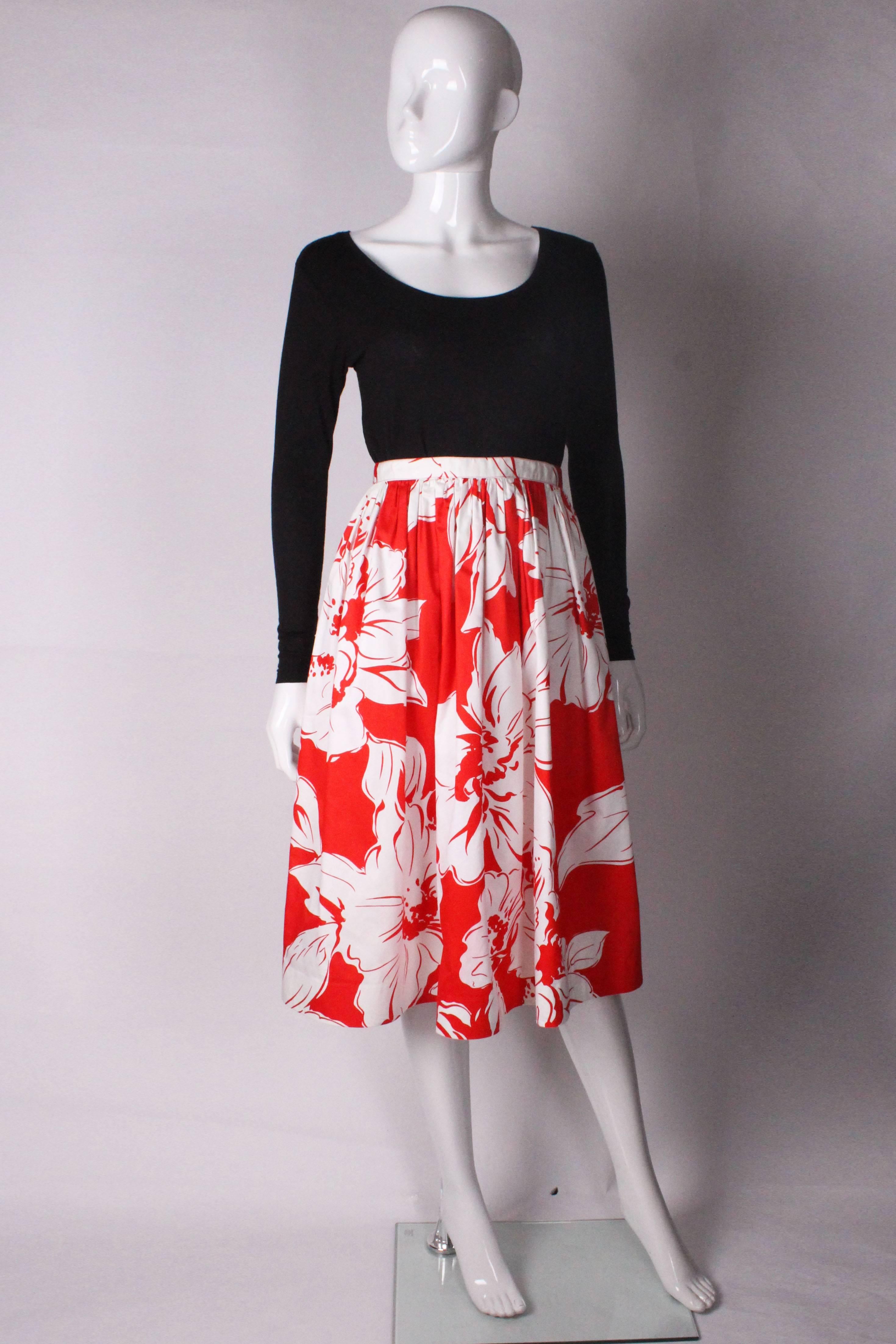 A super skirt for Summer from French house Celine. In a vibrant red and white cotton print, the skirt is fully lined which gives a nice woosh as you walk.
There is a central back zip and a 2'' hem .