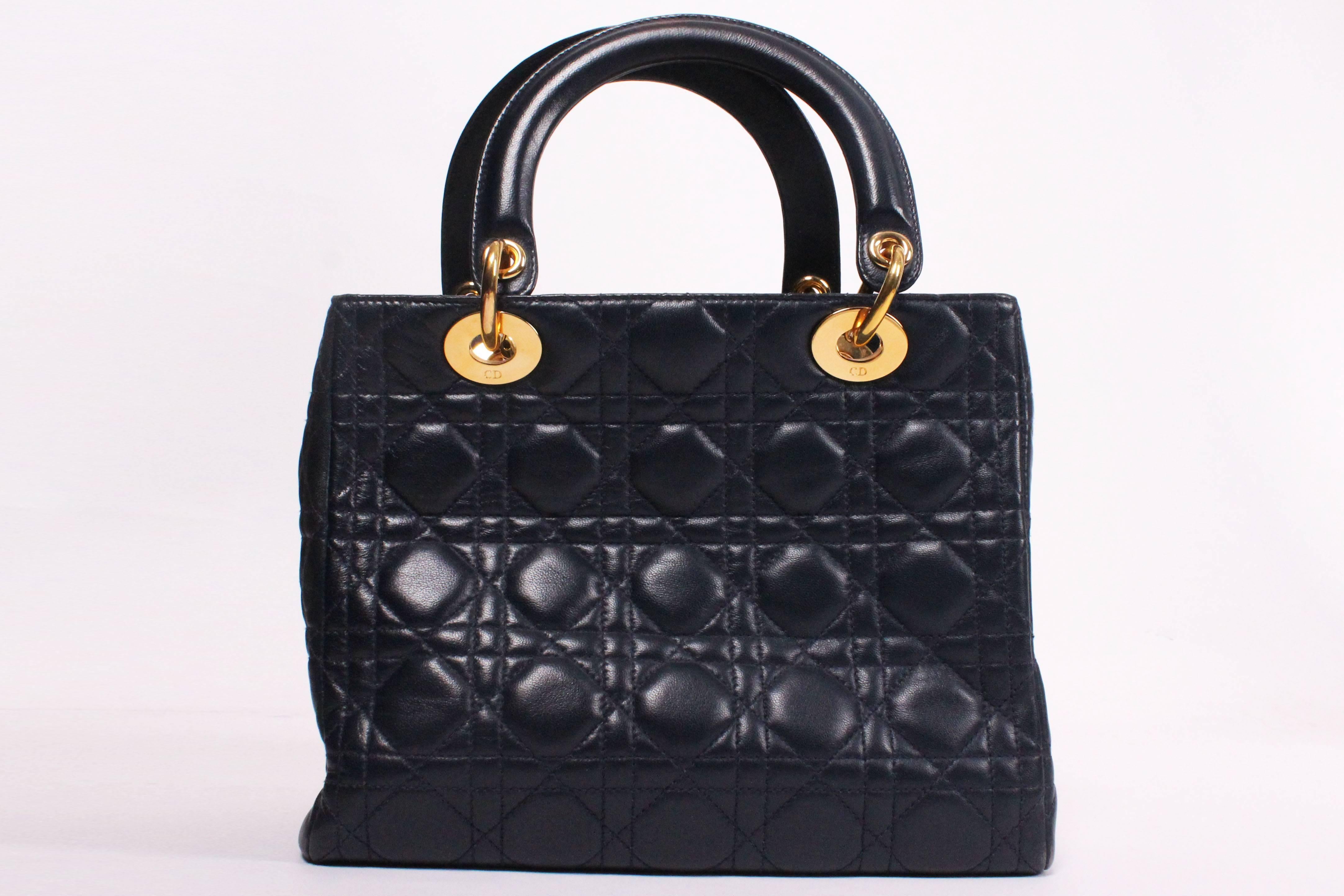 Women's Christian Dior D bag in Navy leather.