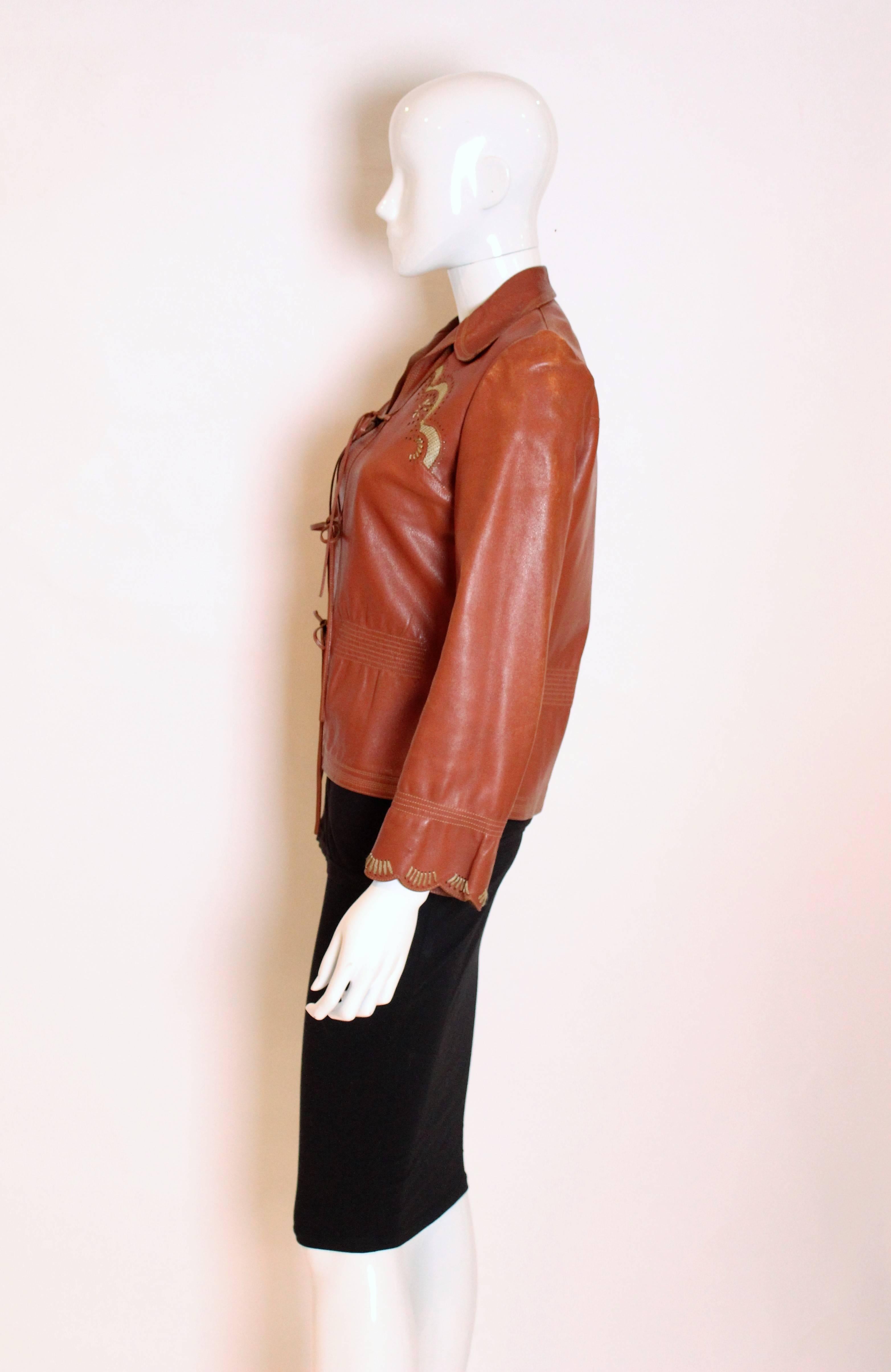 Orange 1970s leather jacket by Jean and Michael Pallant