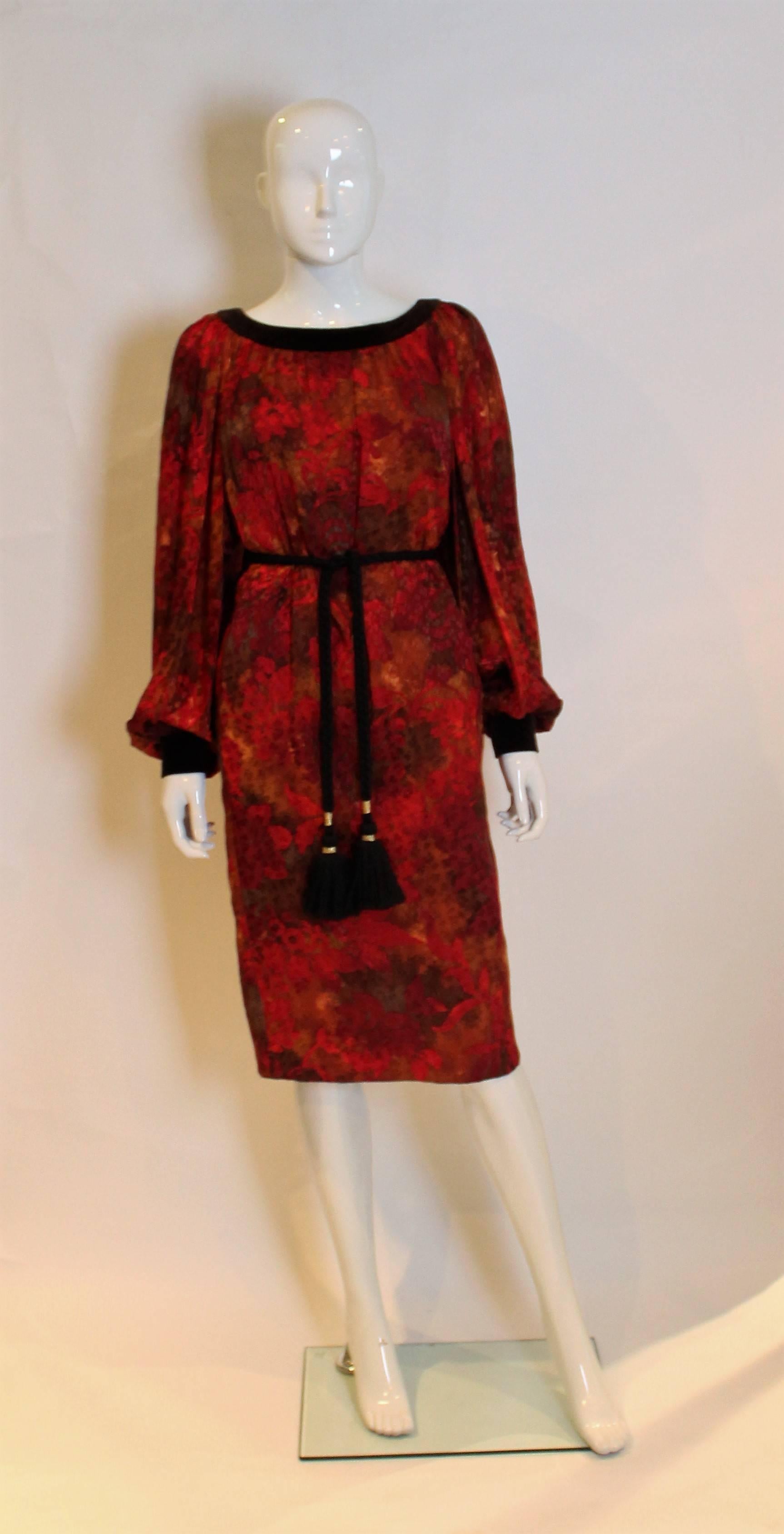
A great dress by Yves Saint Laurent, Patron Original ,number 56337.
The dress is a wonderful mix of autumn colours , with silk velvet trim and cuffs and silk lining. It has a deep round neckline at the front and deeper neckline at the back.There is