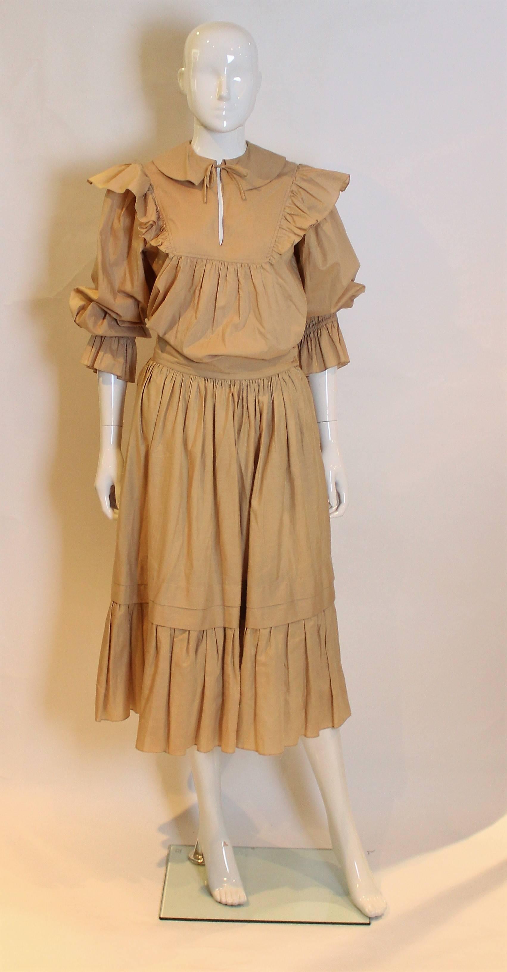  A great outfit by Christian Dior, Tricots et Coordinees.
The top is size 38, number 883, with a round collar, frills around the yoke and elbow length sleeves. The skirt is number 368 42420/32430 with a  wide waistband, pockets on either side, and 2