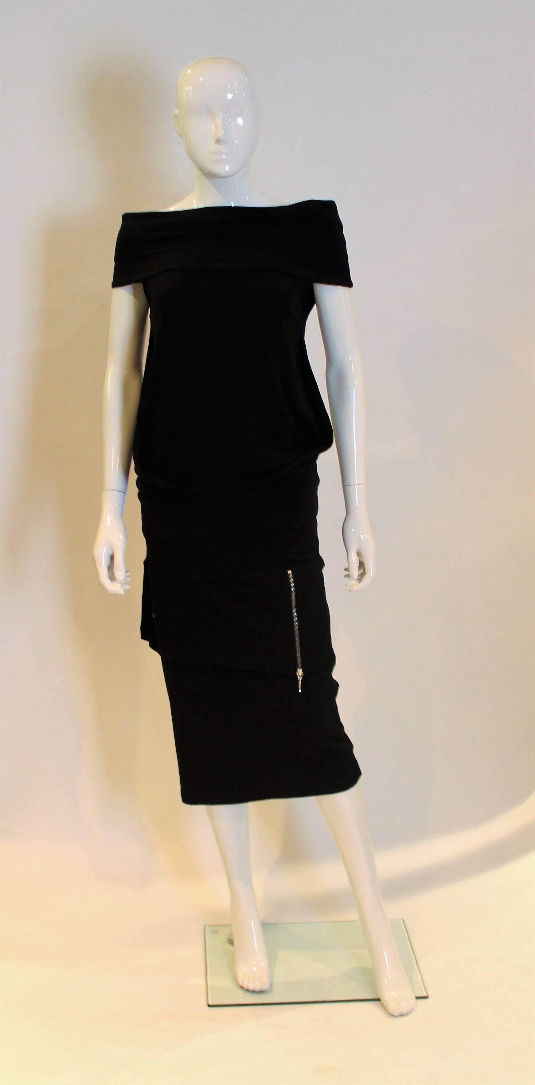 Super chic, skirt and top by French designer Plein Sud.The top has a wide band that sits off the shoulder and then a tube body. There is a matching skirt.