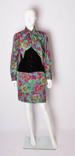 A vintage 1980s Ungaro silk floral tie neck dress