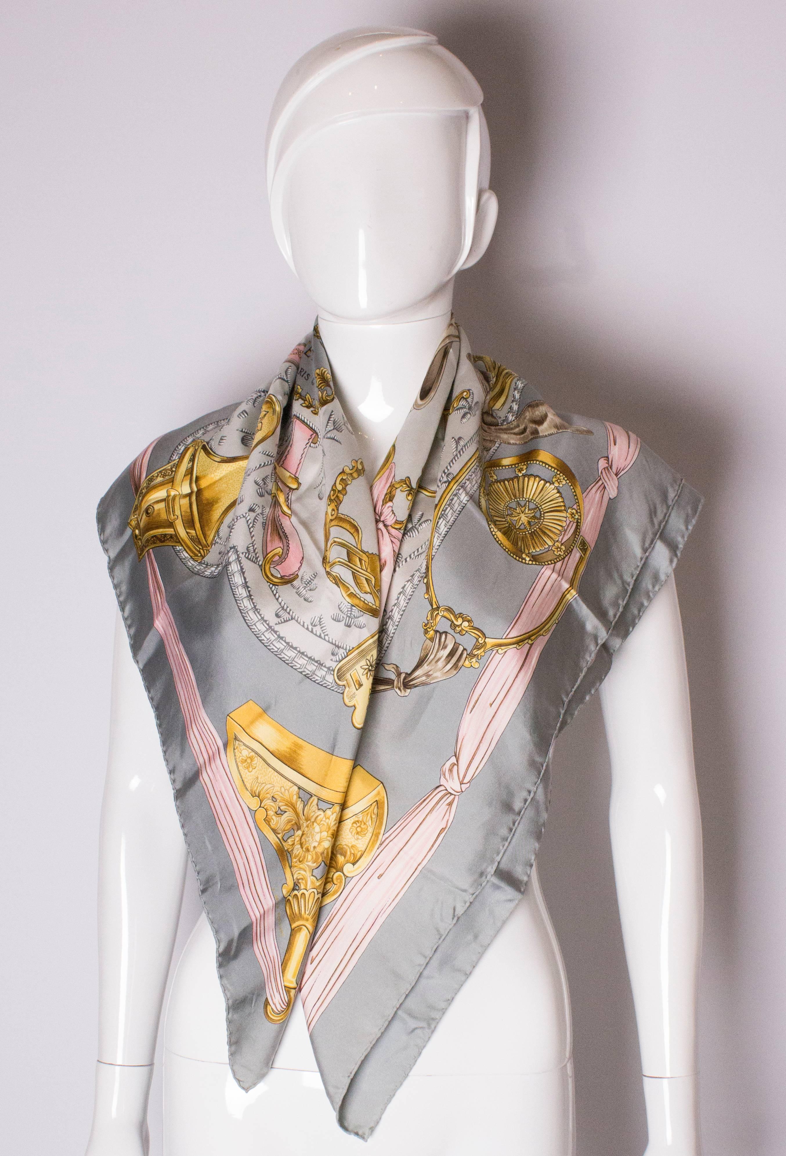 A super scarf by Hermes, Etriers design with a dove grey border, pink, gold and grey design.