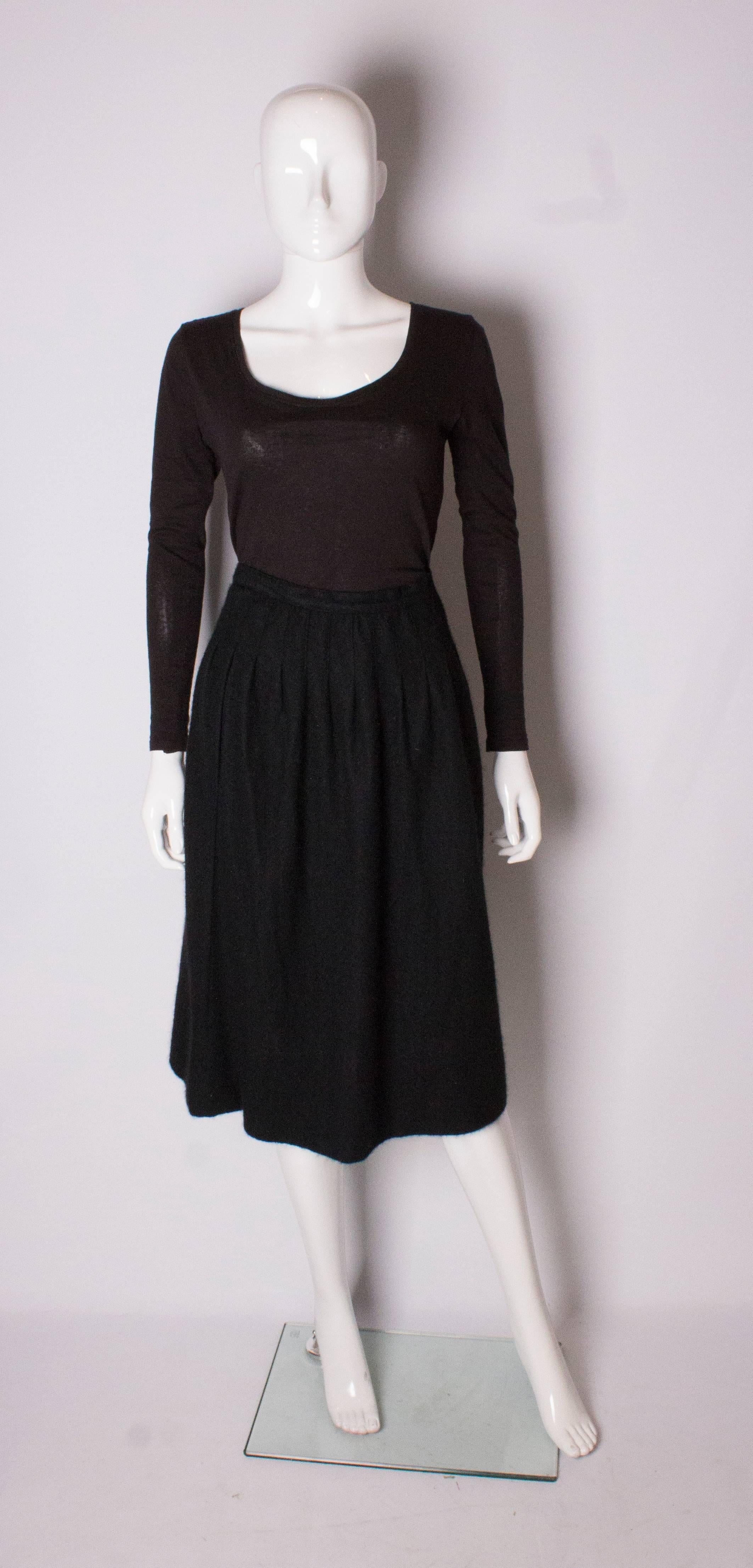 A cosy cashmere skirt by Yves Saint Laurent Rive Gauche. The skirt is unlined, and has pleats on the front  and back. The skirt has a zip opening on the left hand side.