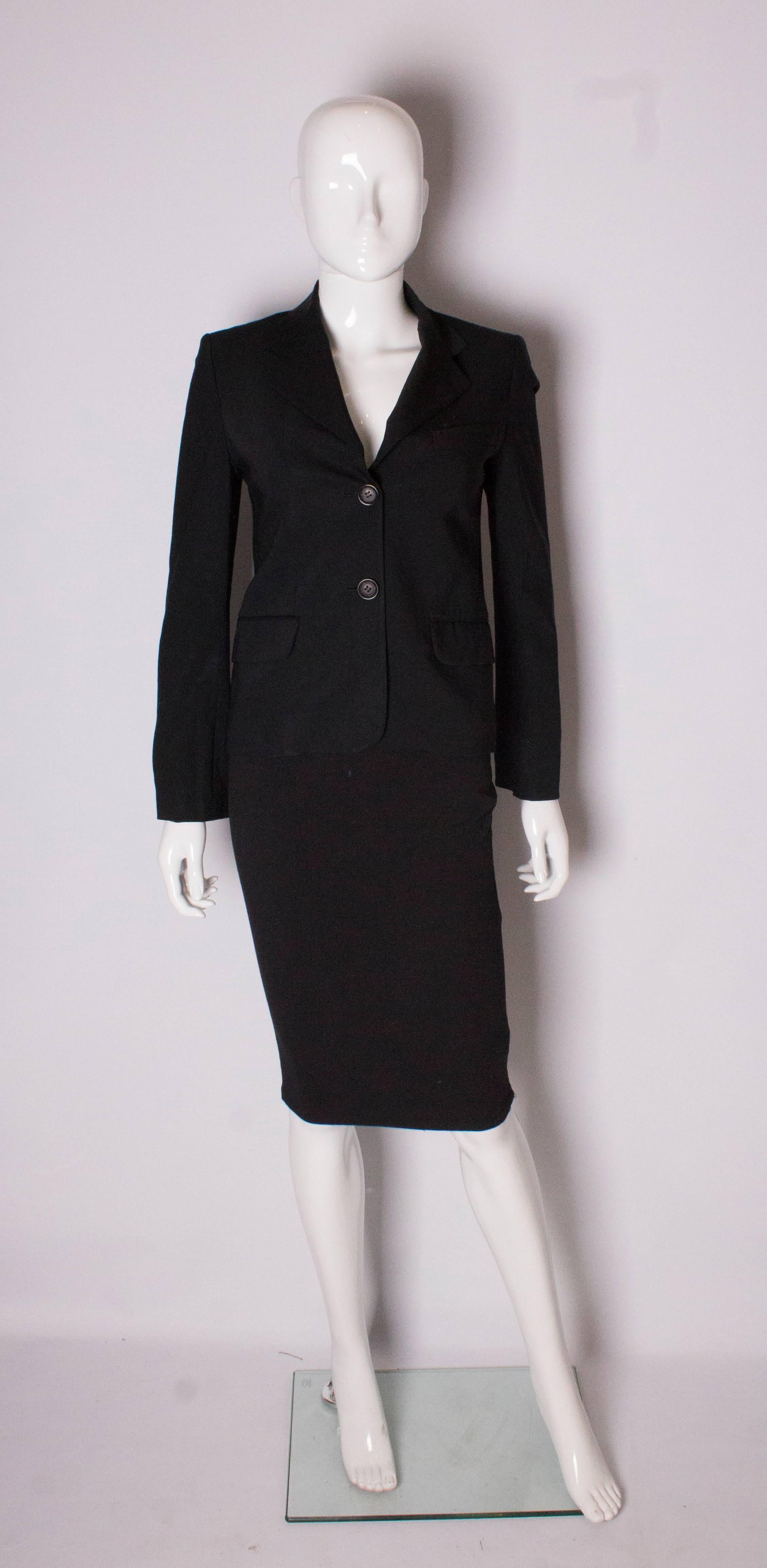 A chic jacket by Celine. The jacket is a wool mix, with one breast pocket and two waist pockets. It is fully lined and has a 2 button opening.