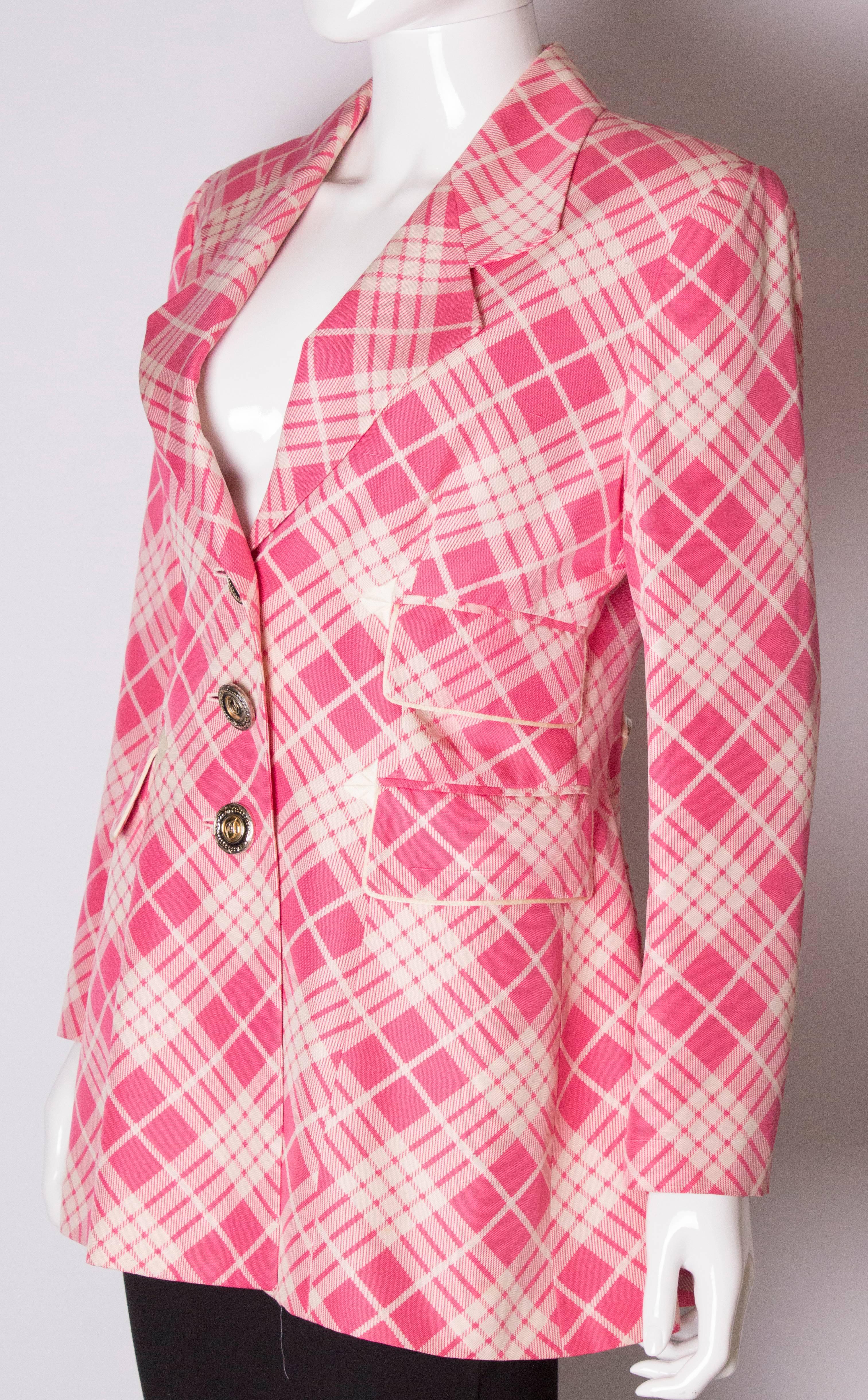 A great jacket for spring, by Christian Dior Boutique Paris, number 89815.The jacket has a v neckline, 3 button fastening ,2 flap pockets on the right handside and one on the left hand side. The jacket has a peplum like lower area with a 1/ belt at