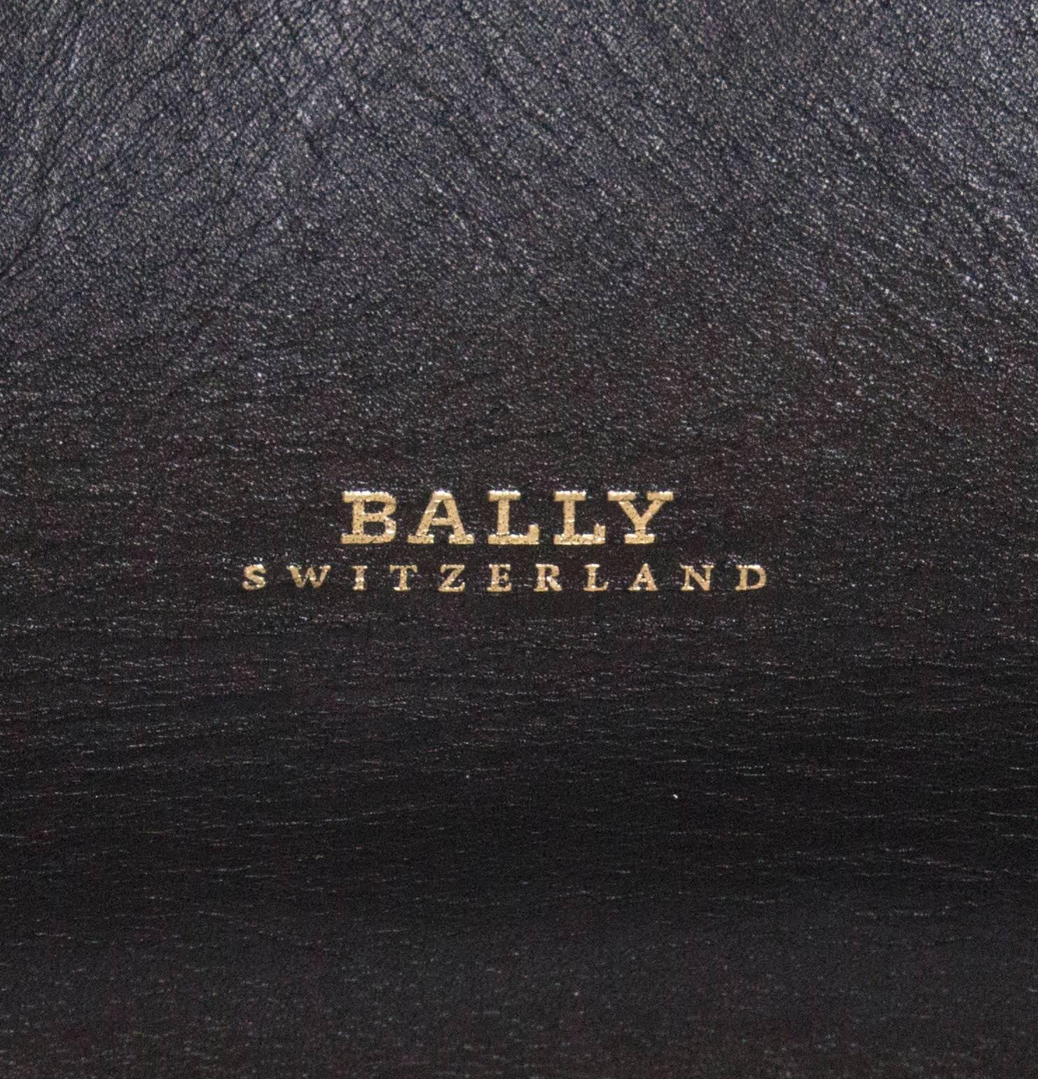 A soft leather bag by Bally . The bag as 2 large handles and 2 small handles and can be worn as a shoulder bag or hand bag.
It has a lined base, and the dimensions are : base 10'' x 11'', height  15''.