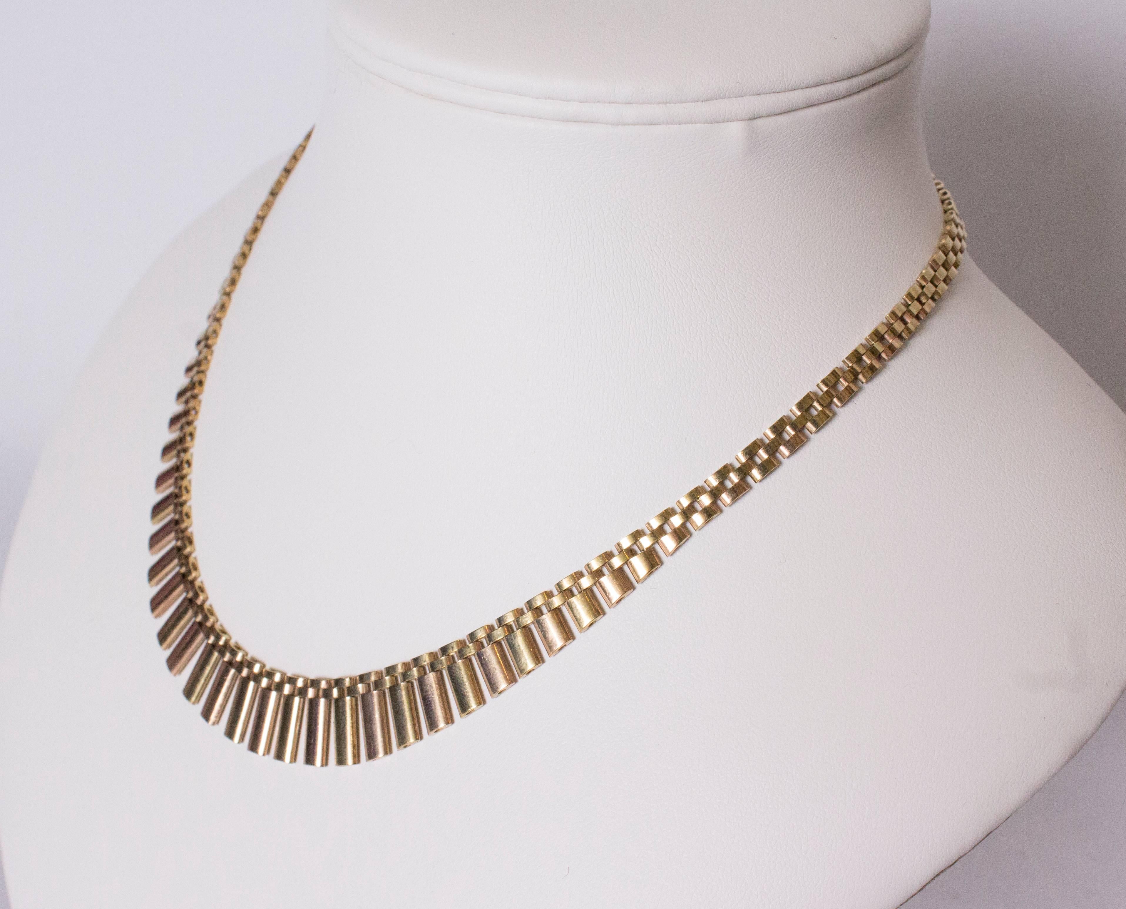 A chic necklace in yellow and rose gold. The necklace measures, 17'' and has clip over clasp.