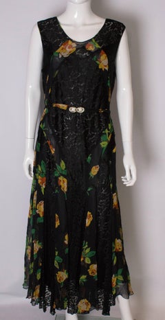 A Vintage 1920s floral silk print and black lace gown and matching bolero