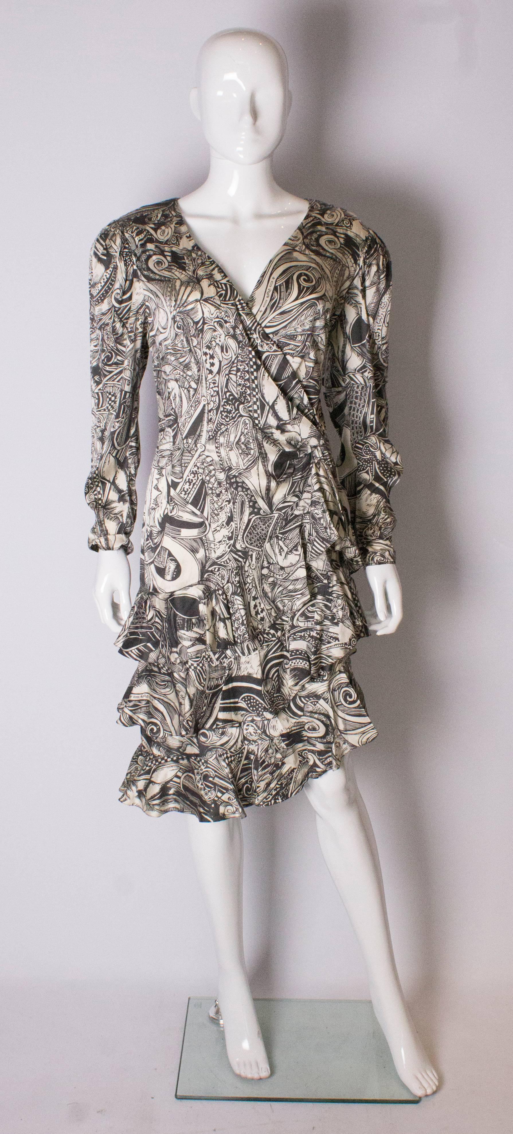 A chic silk dress by Helen Anderson . The dress is in an abtract print, and has a v neckline with long sleeves , a tiered ruffle skirt  and central back zip.
