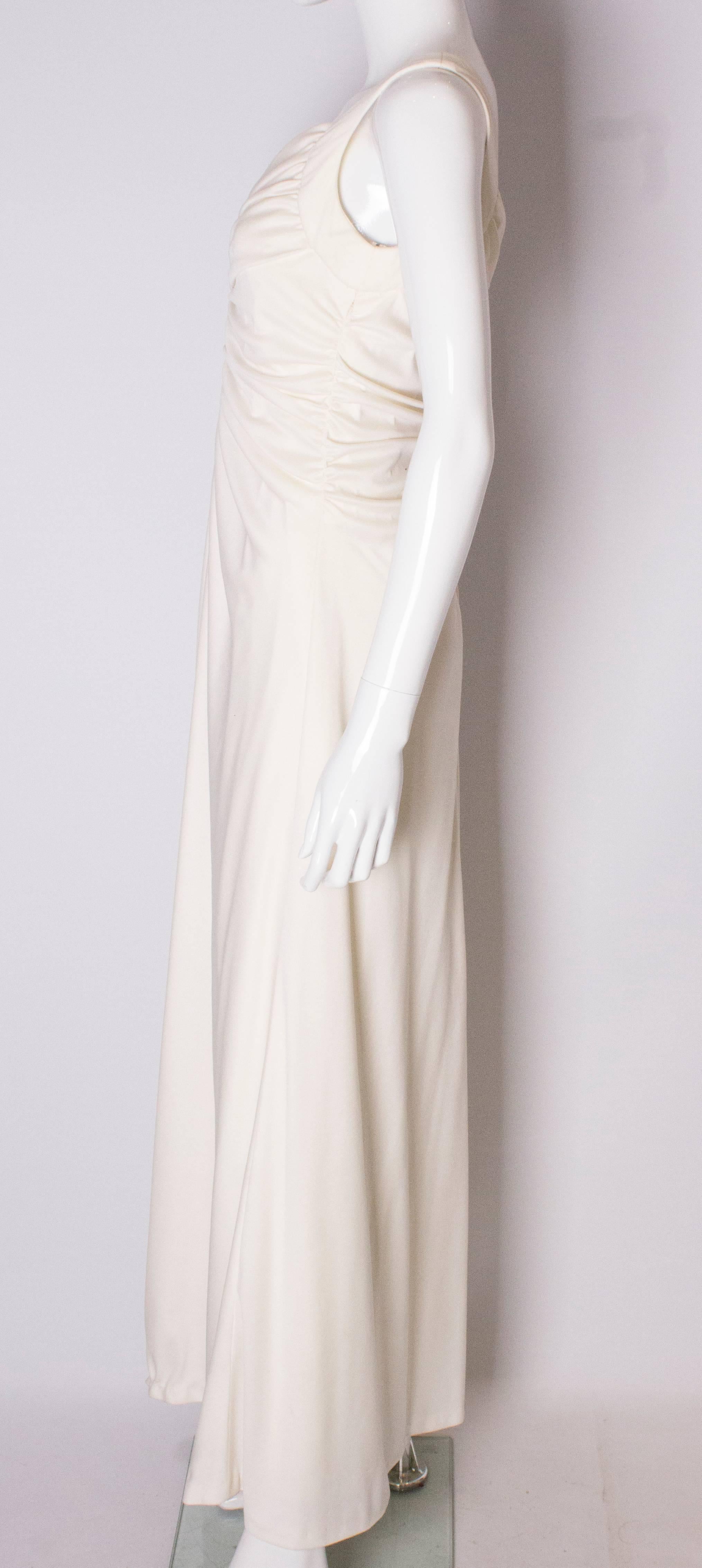 A Vintage 1970s cream evening dress by Maddison Avenue London  1
