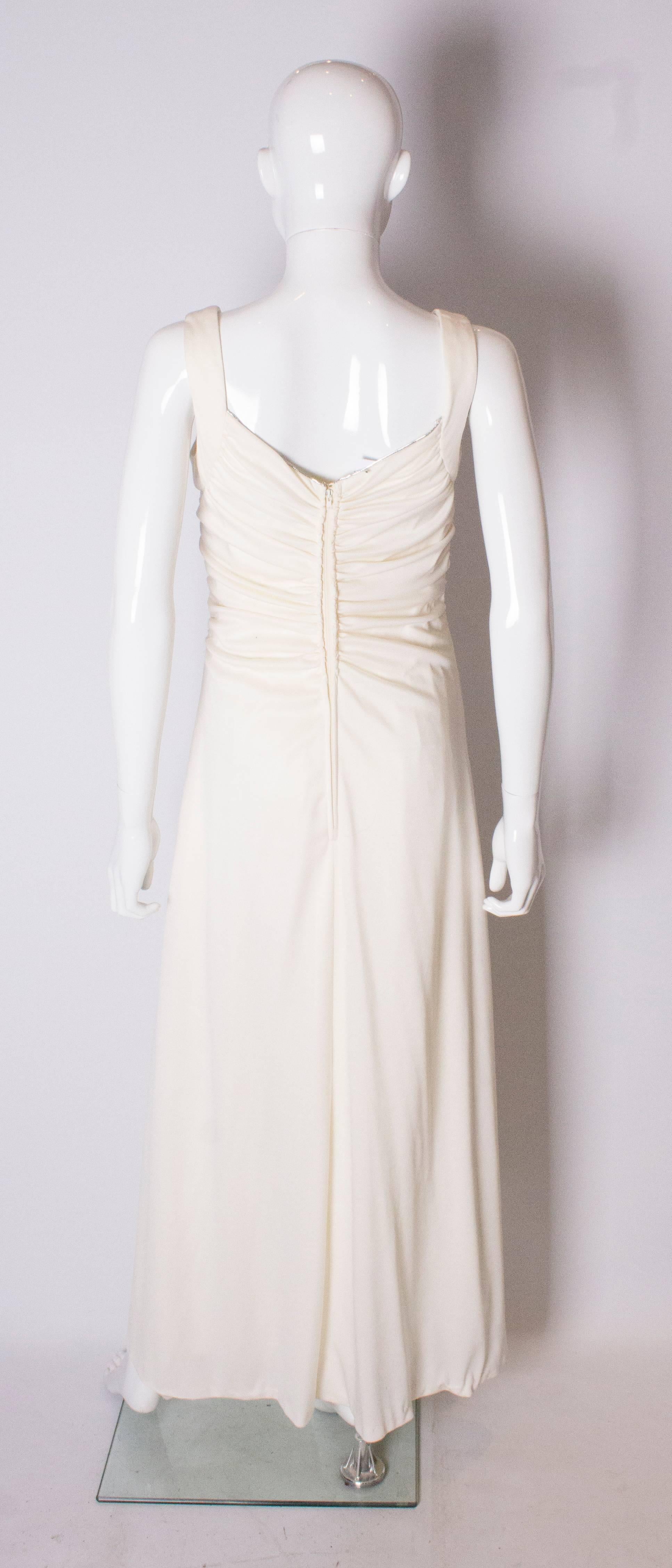 A Vintage 1970s cream evening dress by Maddison Avenue London  2