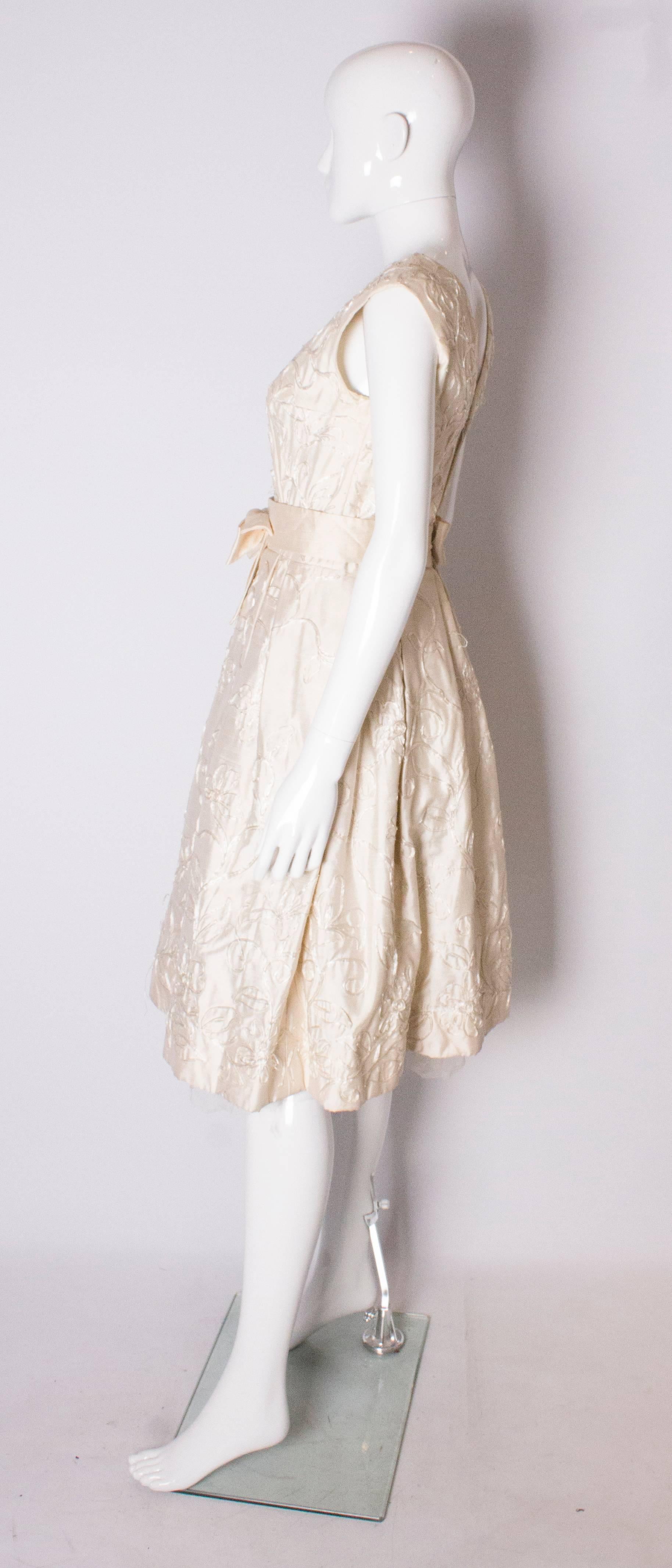 Beige A Vintage 1950s ivory cocktail bridal dress by Julian Roe for Adaire London
