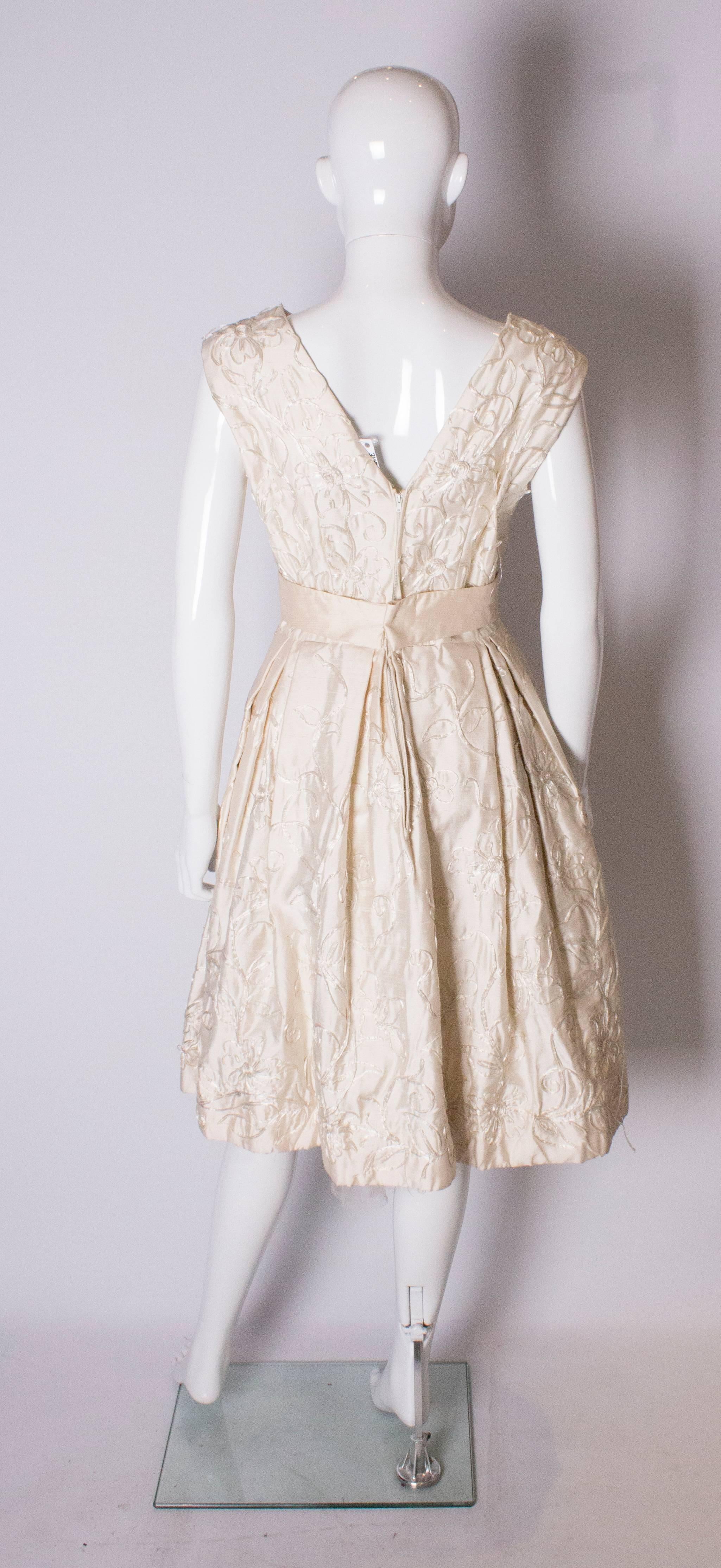 A Vintage 1950s ivory cocktail bridal dress by Julian Roe for Adaire London 1