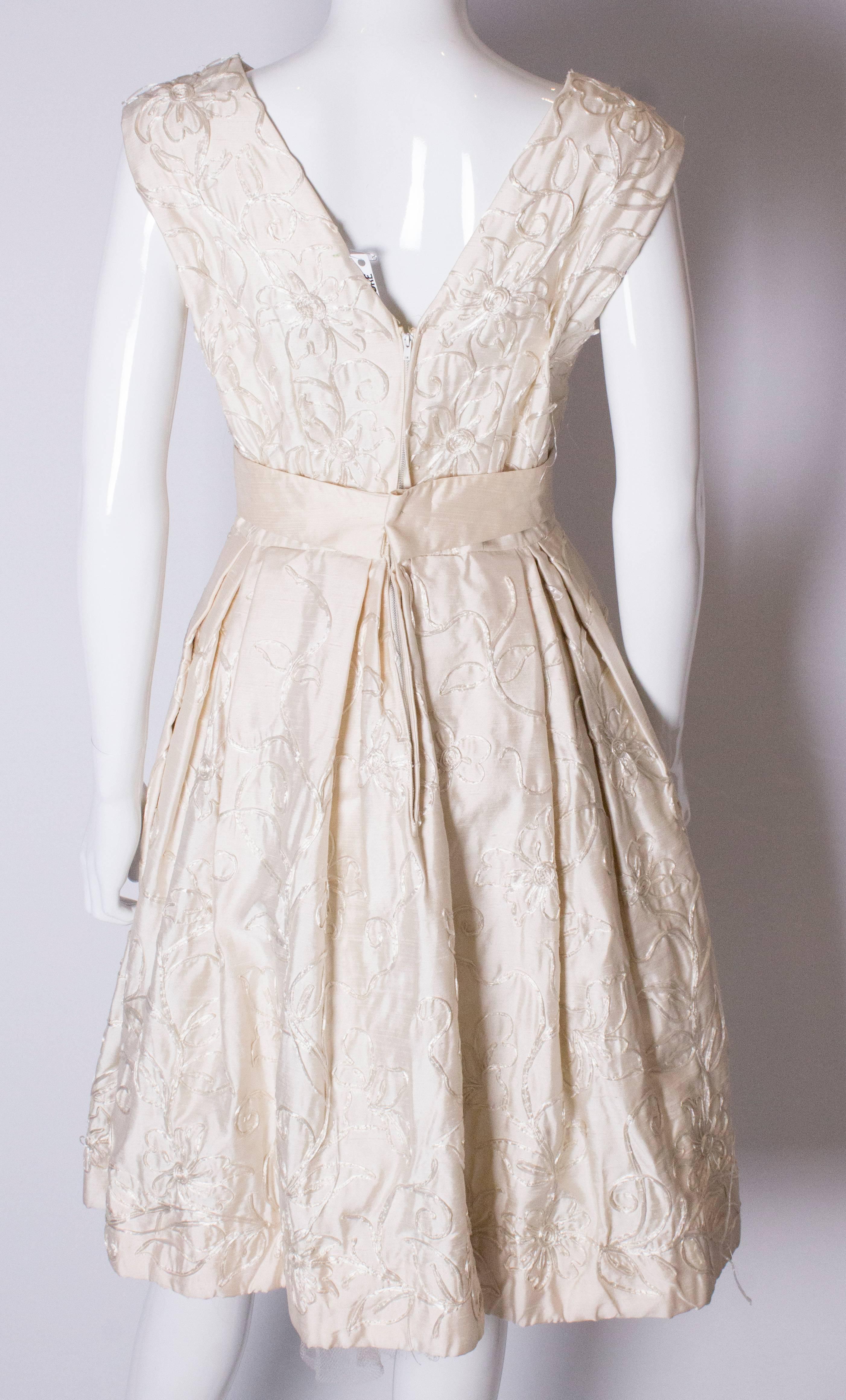 A Vintage 1950s ivory cocktail bridal dress by Julian Roe for Adaire London 2