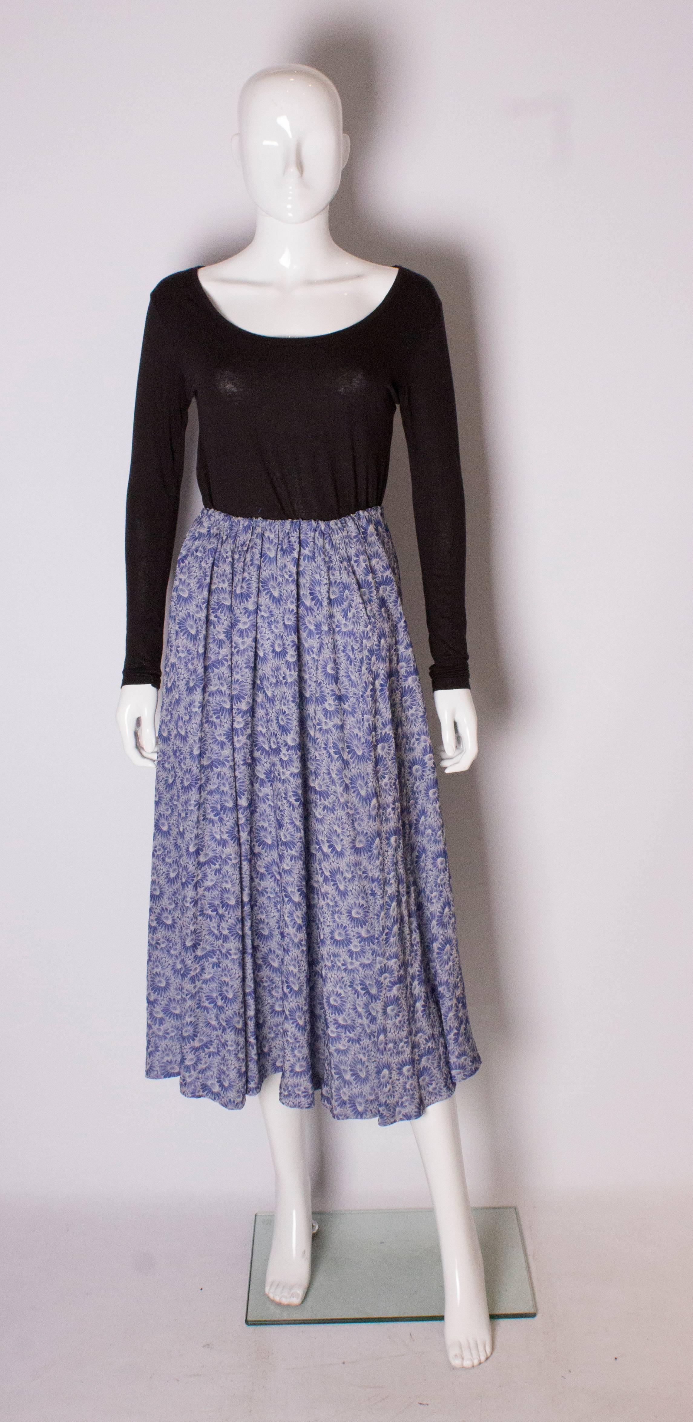 A pretty silk skirt for spring and summer. In a blue floral print silk, the skirt has an elasticated waist.