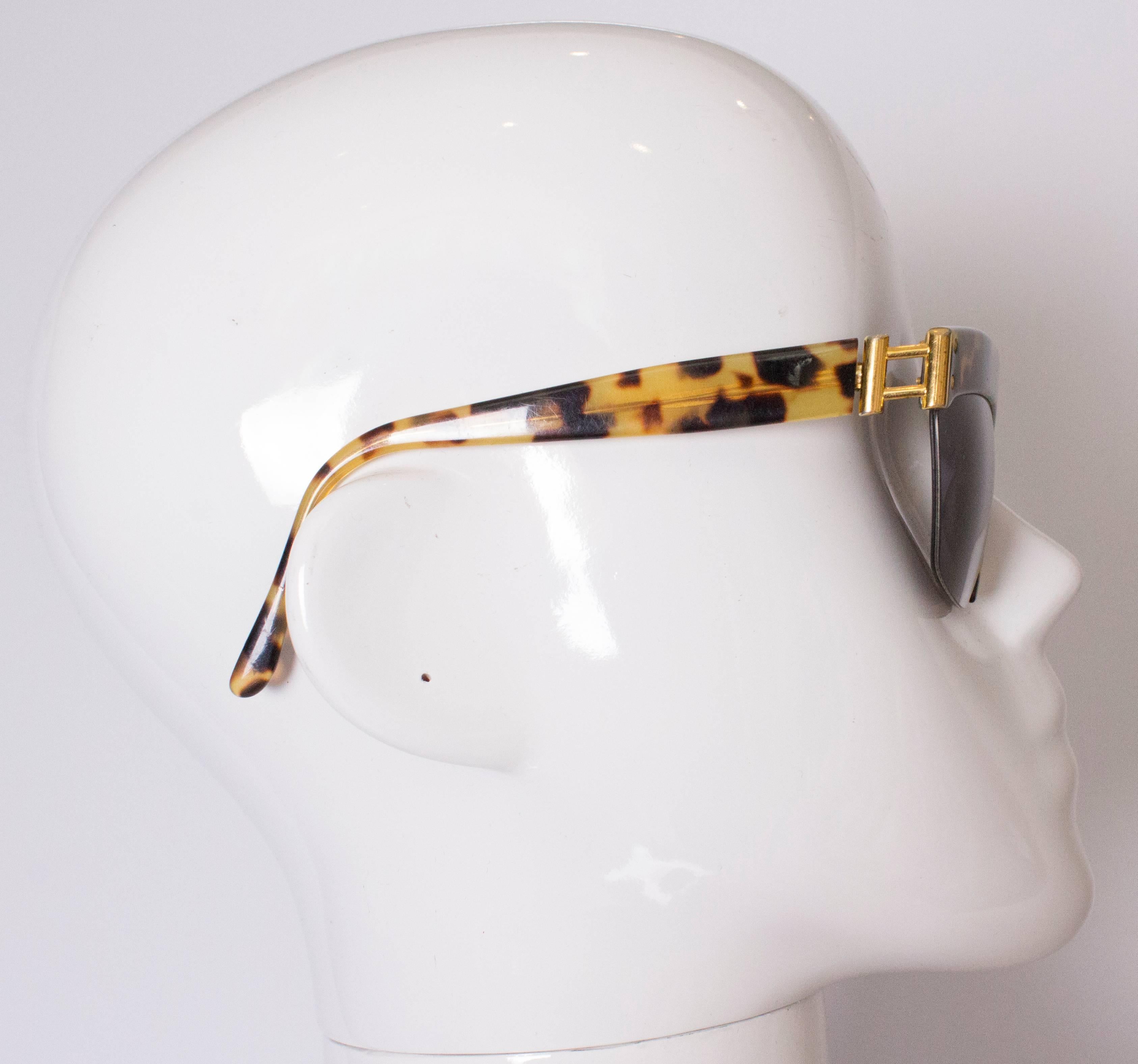 A chic pair of 1970s  sunglasses by Charme. These sunglasses have an animal print frame and are model 70/74N , col 510.